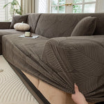 housse canapé extensible beige clair motif feuilles imprimées moderne protection meubles