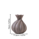 vases céramique texturé moderne minimaliste fougères séchées décoration intérieure arrondis lignes verticales blanches brunes