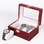 boîtes montres marron foncé compartiments bois luisants poignées dorées classiques organisateur montres luxueuses