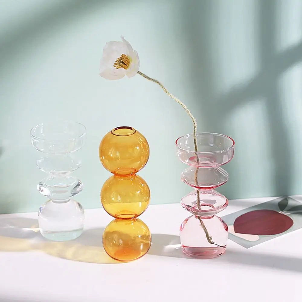 vases verre transparent moderne orange rose sphères empilées décoration maison table fleurs hydroponiques
