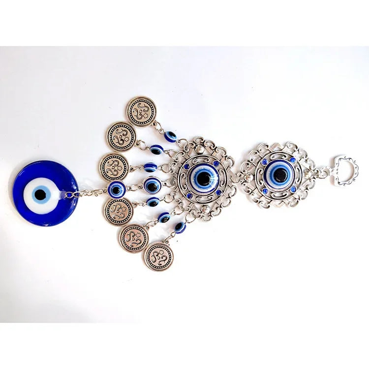 Pendentif oeil turc bleu argenté motifs géométriques artisanal protection maison