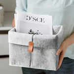 boîte rangement tissu veloutée gris clair foncée moderne pliable articles divers serviettes blanches broderie