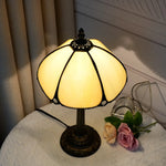 lampe table art déco bronze beige translucide motifs géométriques verre teinté base solide chambre