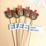 décorations gâteau happy birthday multicolore nounours chapeau banderoles géométriques festives piquées bois
