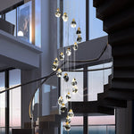 suspension lumineuse moderne transparente dorée facettes géométriques élégante leds
