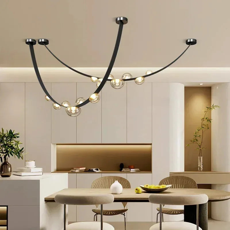 Suspension lumineuse contemporaine boules translucides structure métallique noir marron doré minimaliste