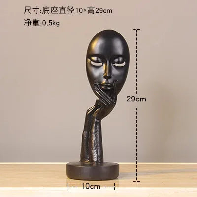 masque sculptural contemporain noir blanc doré finement sculpté base circulaire ornement salon