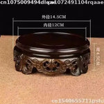 support bois ornements sculptés complexe artisanal marron foncé traditionnel décoration maison objet décoratif stand