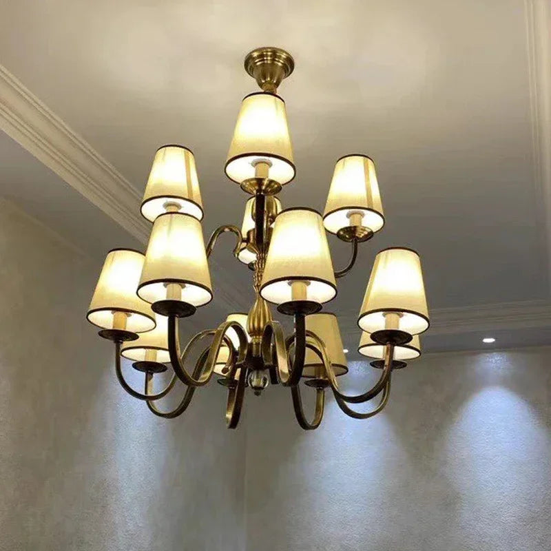chandelier bronze classique suspension lumière abat jours tissu texturé courbes salle manger
