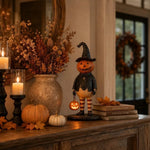 figurine halloween citrouille orange visage chapeau robe bas suspendue noire