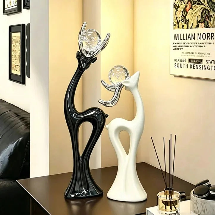 statues cerfs noir blanc sphères verre argentées décoration moderne salon meuble tv armoire vin