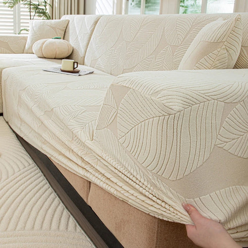 housse canapé extensible beige clair motif feuilles imprimées moderne protection meubles