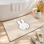 tapis bain dessin animé lapins gris jaune vert bleu rayures enfantin absorbant