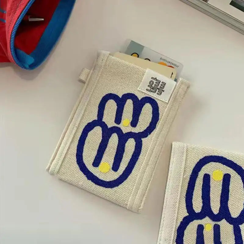 porte cartes toile dessin animé visage stylisé cartes bancaires enfantin minimalisteversible attaches plastique