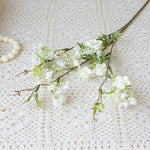décoration intérieure fleurs artificielles soie rose blanc jaune vert branches feuilles vases transparents printemps