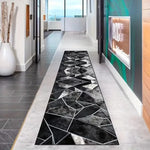 tapis moderne géométrique noir gris blanc salon entrée contemporain polyestère aubusson lavage machine