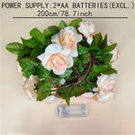 décoration intérieure guirlande lumineuse fleurs roses feuillage vert mariage romantique festive polyester led piles