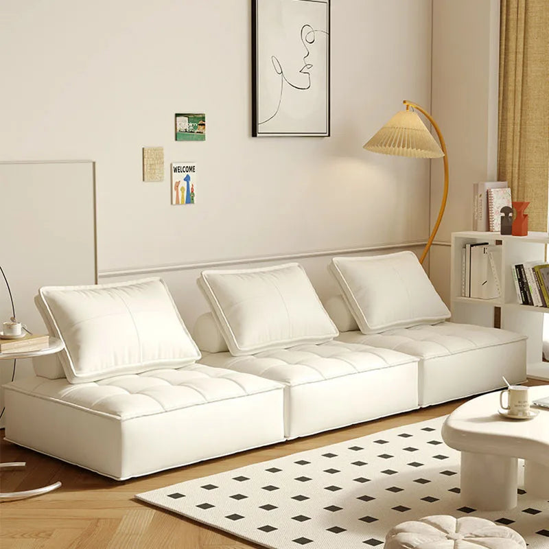canapé lit moderne cuir noir blanc marron oreillers minimaliste salon