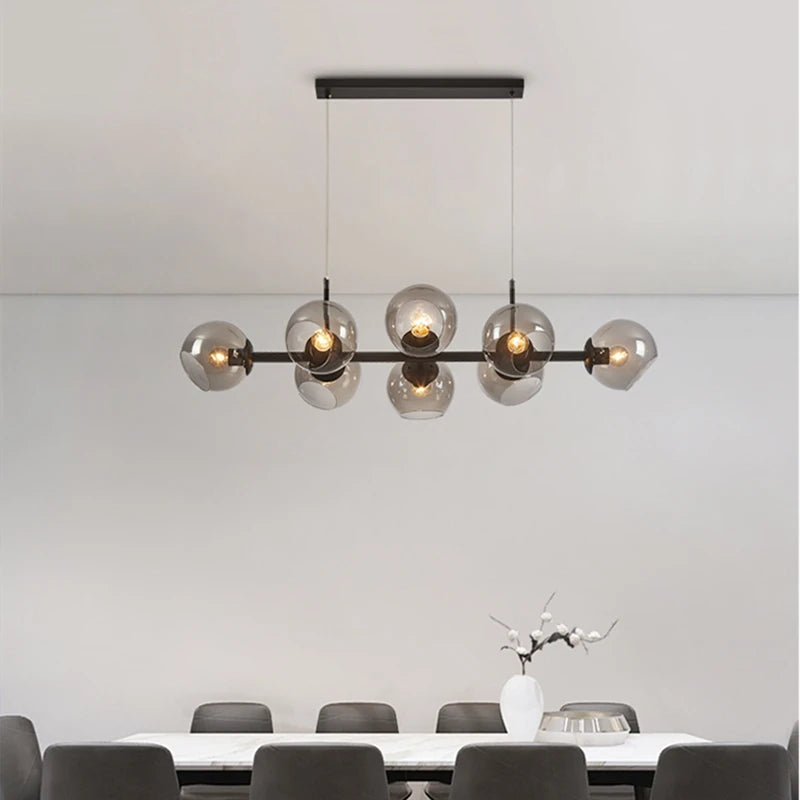 Suspension lumineuse moderne sphères transparentes dorées structure métallique noir chambre salon