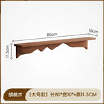 étagère murale bois marron clair texture naturelle moderne vis fixations objets rangement maison