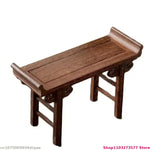 meuble pliant bois sculpté finition lisse traditionnel artisanal plateau pieds marron foncé