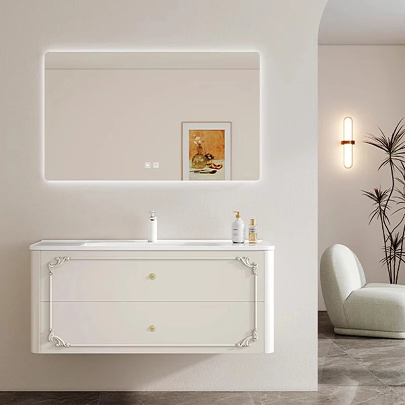 meuble salle bain noir blanc tiroirs vasque ornements dorés classique fixations murales accessoires cosmétiques