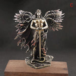 figurines anges ailes plumeuses bronze patiné symbolique épée serpent religieux spiritualité