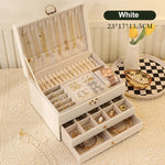 boîte bijoux simili cuir portable miroir moderne élégante poignées métalliques compartiments