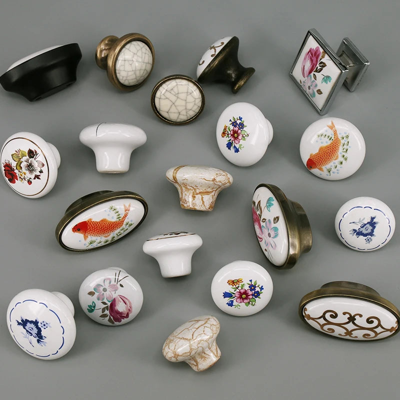 boutons meuble céramique blanc or noir fleurs poissons géométriques classiques