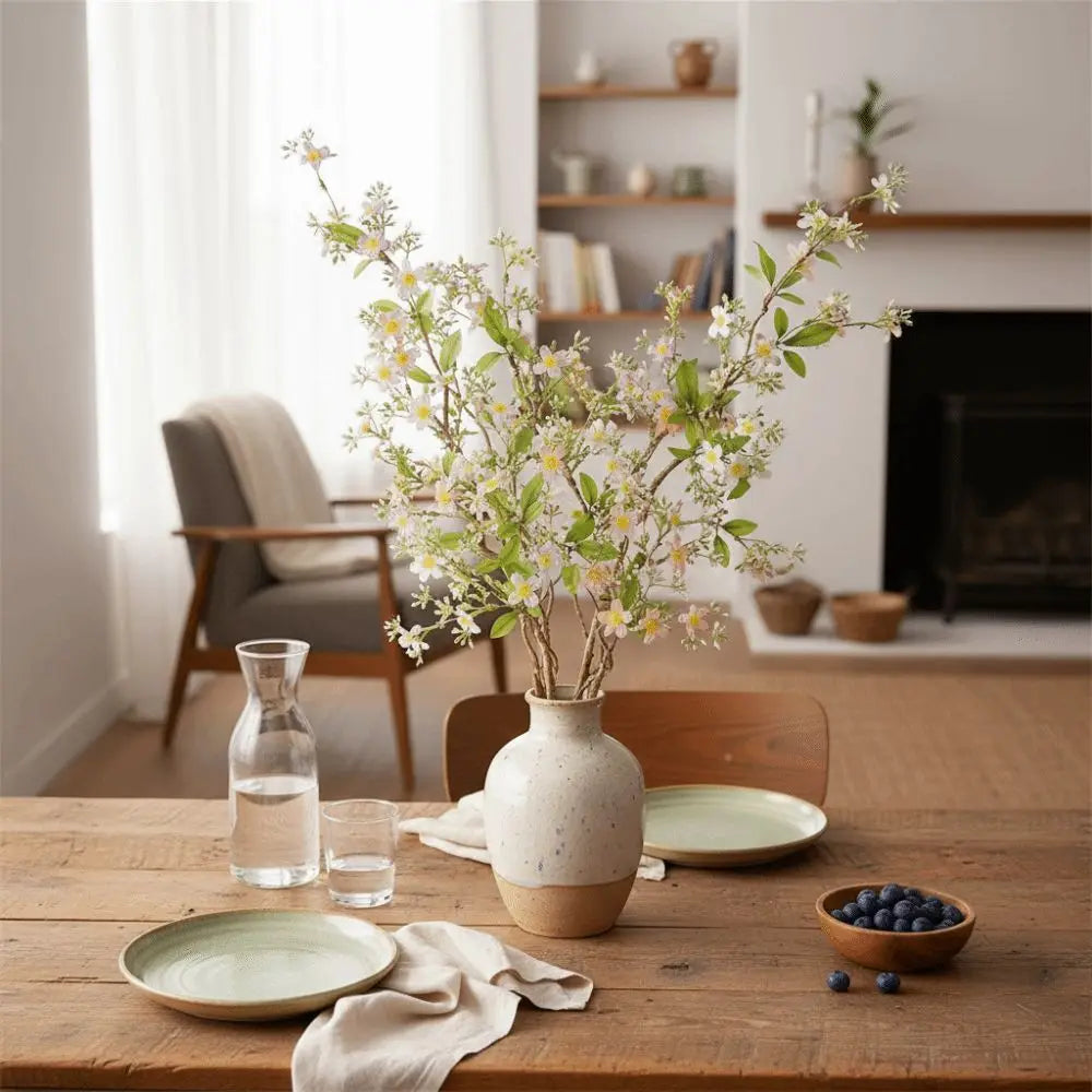 branches artificielles fleurs blanches roses naturelles décoration intérieure vase transparent rustique