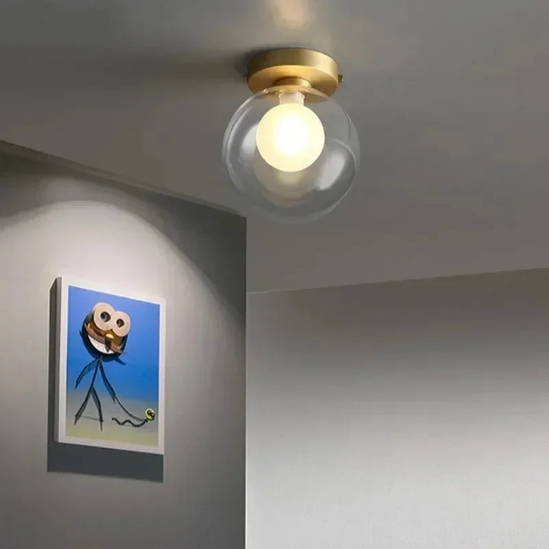 lampe moderne verre transparent noir doré élégante sphérique éclairage contemporain