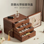 coffret bijoux bois marron tiroirs poignées dorées rangement moderne minimaliste