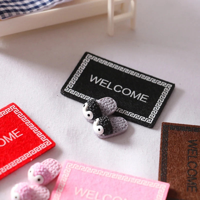 tapis d'entrée moderne rouge rose marron noir motif géométrique texturé animal nature