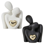 statuette couple stylisé blanc noir cœur doré moderne minimaliste or texturée aspect granuleux