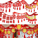 décoration mariage chinois motif double bonheur rouge or papier texturé éléments ajourés pompons rouges