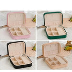 boîte bijoux simili cuir zippée compartiments moderne vert rose beige noir