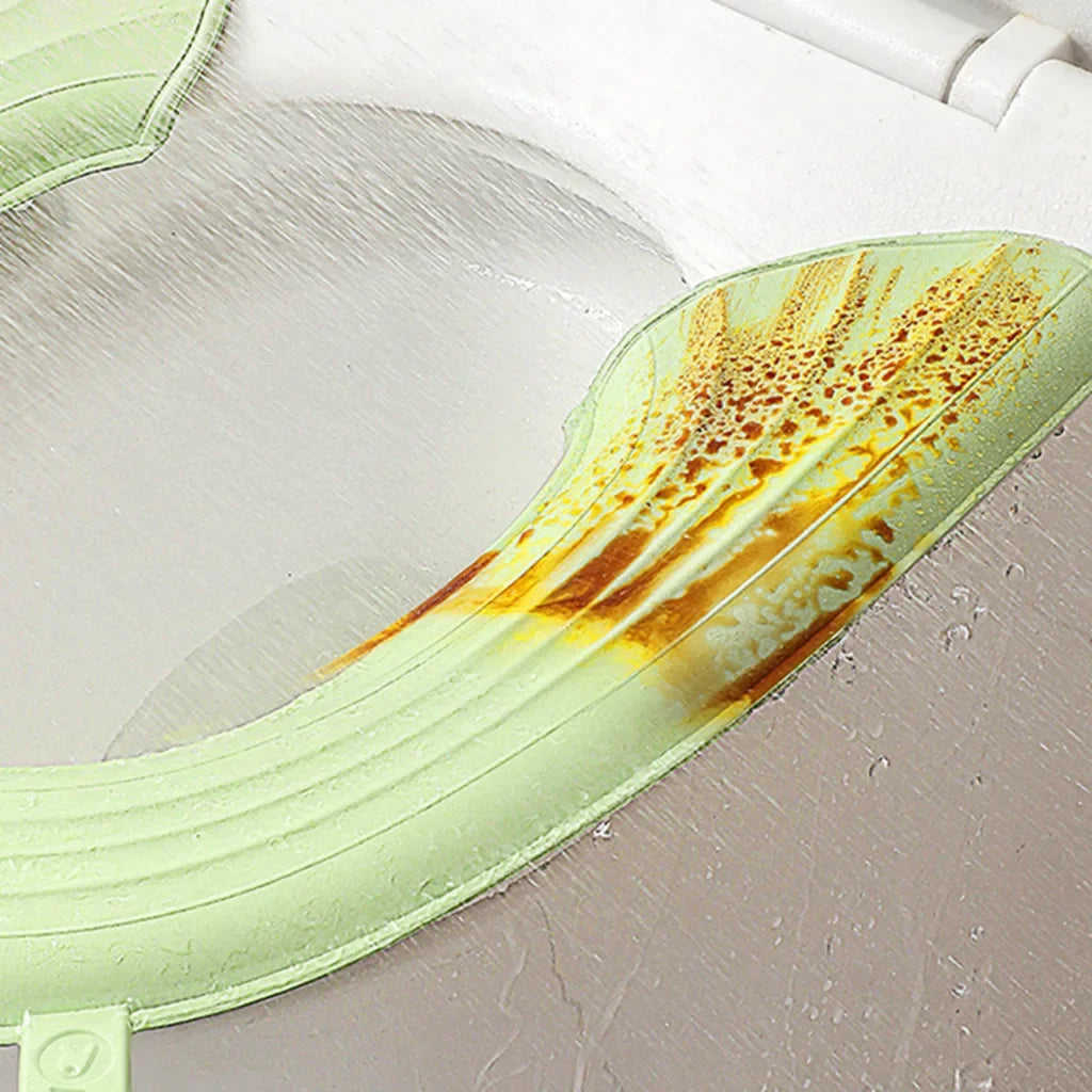 siège toilette pliable vert clair moderne texture souple clips fixation pratique