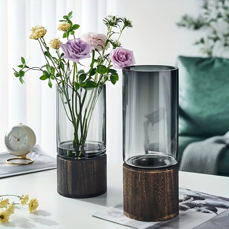 vase verre moderne transparent bois base gris fleurs artificielles décoration intérieure table arrangement floral