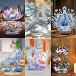 sculpture paon plumes ornements bleus argentés sculpture dragon ailes déployées sculpture loup socle rocheux