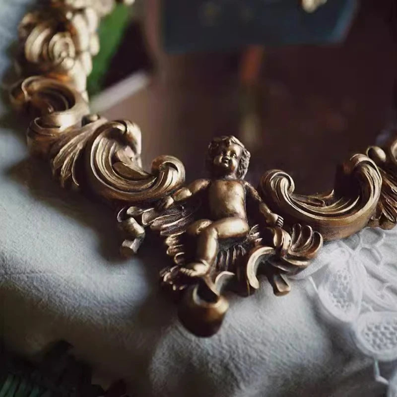 miroir baroque doré ornements sculptés anges chaines decoration maison accessories français