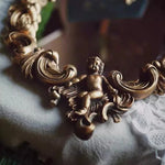 miroir baroque doré ornements sculptés anges chaines decoration maison accessories français