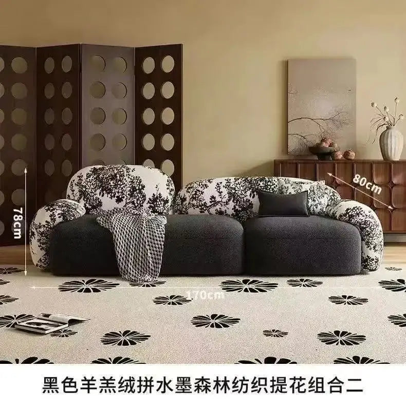 canapé moderne noir blanc fleurs motifs abstraits coussins plateau bois minimaliste italien scandinave
