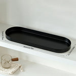 plateau ovale moderne noir mat bijoux parfum flacon lotion bougie calendrier decoration