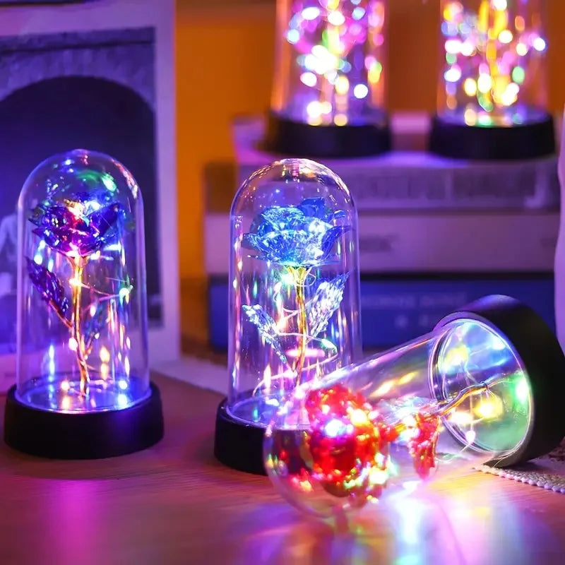 lampe led rose stabilisée dorée feuilles vertes moderne nuit multicolore base noire verre transparent