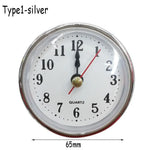 horloges murales classiques quartz blanc doré bronze números romains cadran lignes noires decoration florale