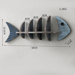 étagère murale poisson bois bleu gris vertèbres décorative plantes artificielles bouteilles parfum lanterne photo