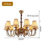 chandelier bronze classique suspension lumière abat jours tissu texturé courbes salle manger