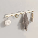 porte sacs mural moderne fixations vis texture bois naturel blanc minimaliste