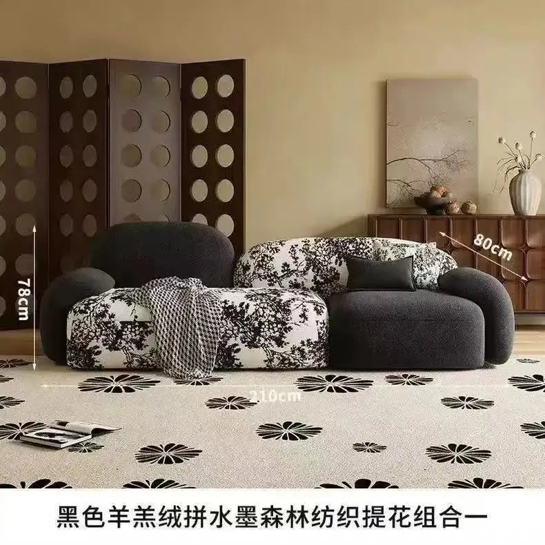 canapé moderne noir blanc fleurs motifs abstraits coussins plateau bois minimaliste italien scandinave