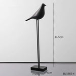 statues oiseaux noir blanc minimaliste sculpture deco intérieur base plate pieds minces